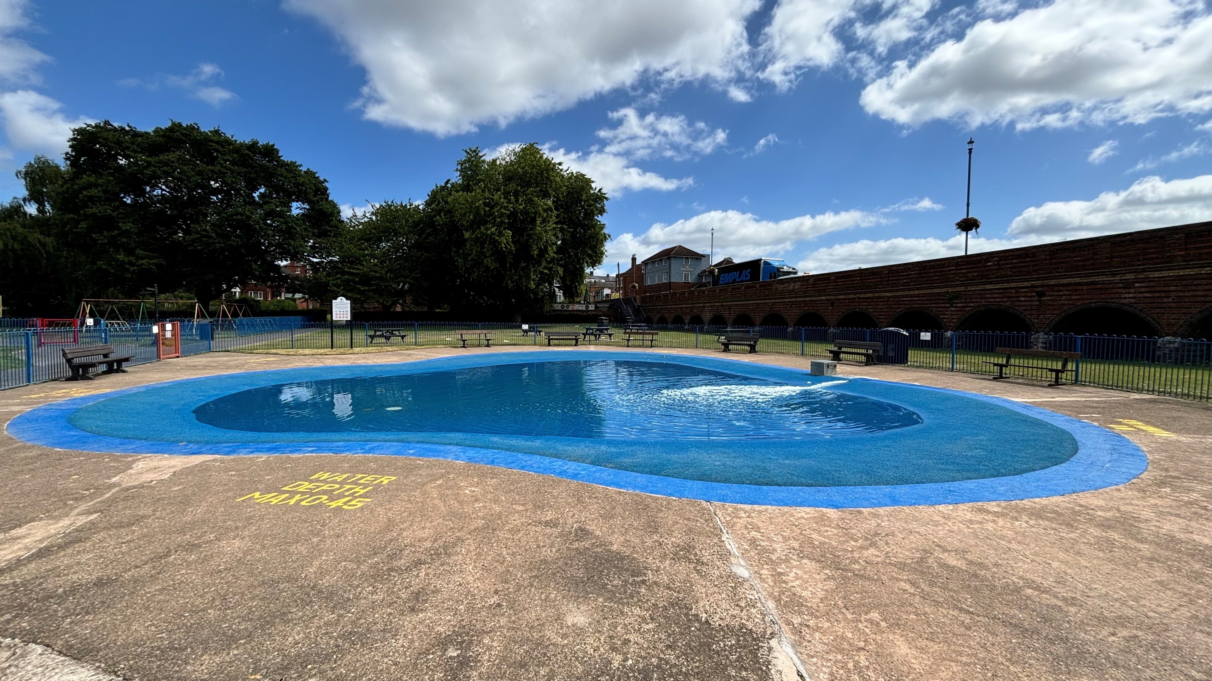 large concrete padding pool in park