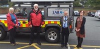 4 people in front of Severn Area Rescue Association Vehicle